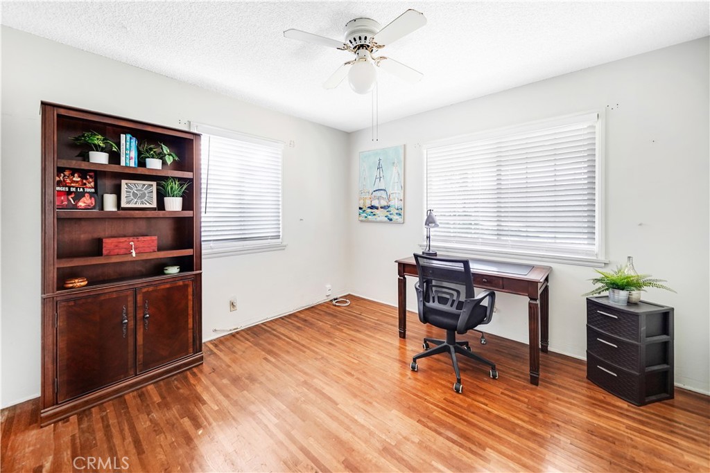 8201 Page Street Buena Park, CA 90621 - Photo 17 of 32 a workspace with furniture bookshelf and a window