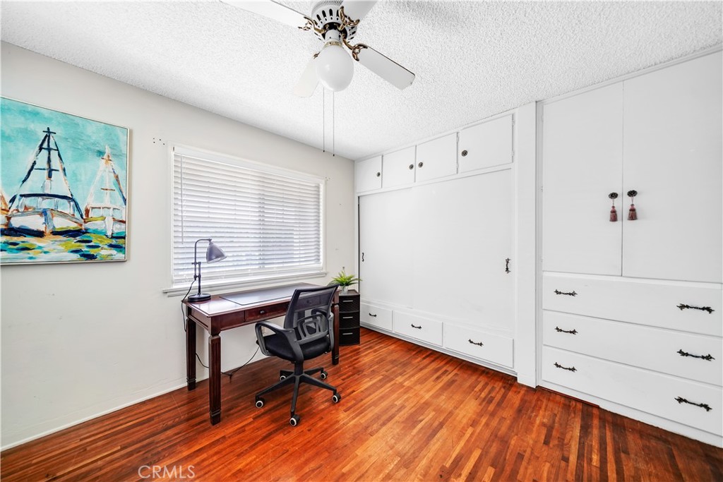 8201 Page Street Buena Park, CA 90621 - Photo 18 of 32 a view of a workspace with furniture and wooden floor