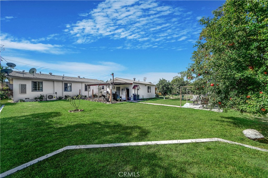 8201 Page Street Buena Park, CA 90621 - Photo 2 of 32 a view of an house with backyard space and balcony