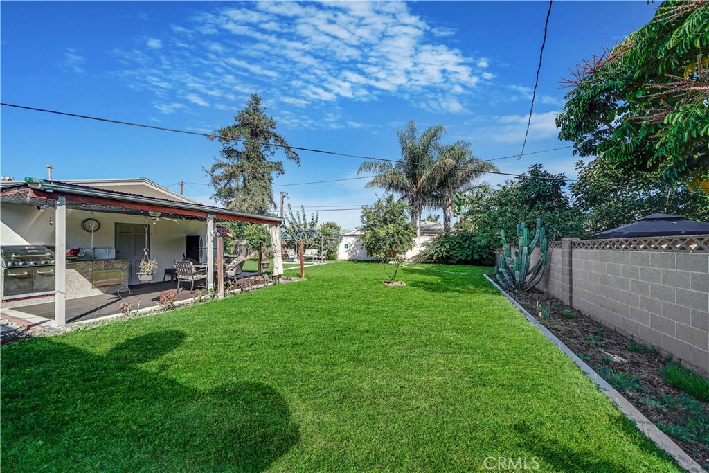 8201 Page Street Buena Park, CA 90621 - Photo 25 of 32 a view of a house with backyard porch and garden