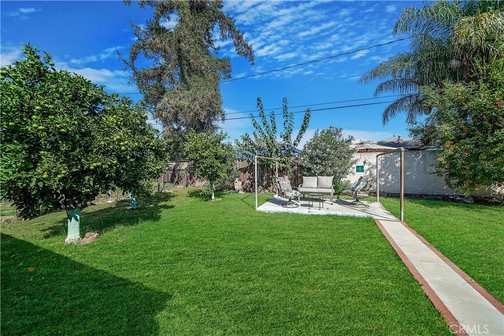 8201 Page Street Buena Park, CA 90621 - Photo 28 of 32 a view of a house with backyard sitting area and garden
