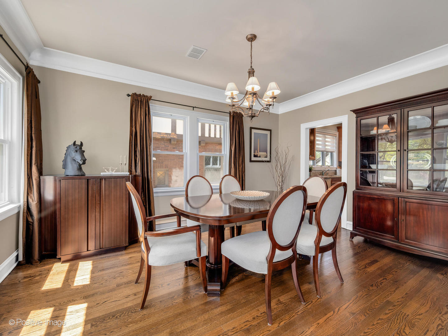 302 Southcote Road Riverside, IL 60546 - Photo 11 of 40 a view of a dining room with furniture wooden floor and chandelier