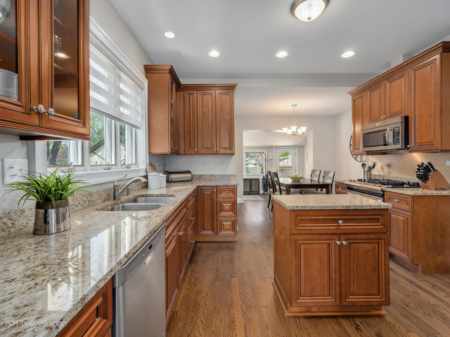 302 Southcote Road Riverside, IL 60546 - Photo 14 of 40 a kitchen with granite countertop lots of counter top space and wooden floor