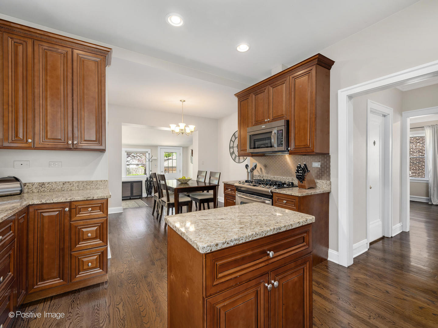302 Southcote Road Riverside, IL 60546 - Photo 15 of 40 a kitchen with a stove a sink and a refrigerator