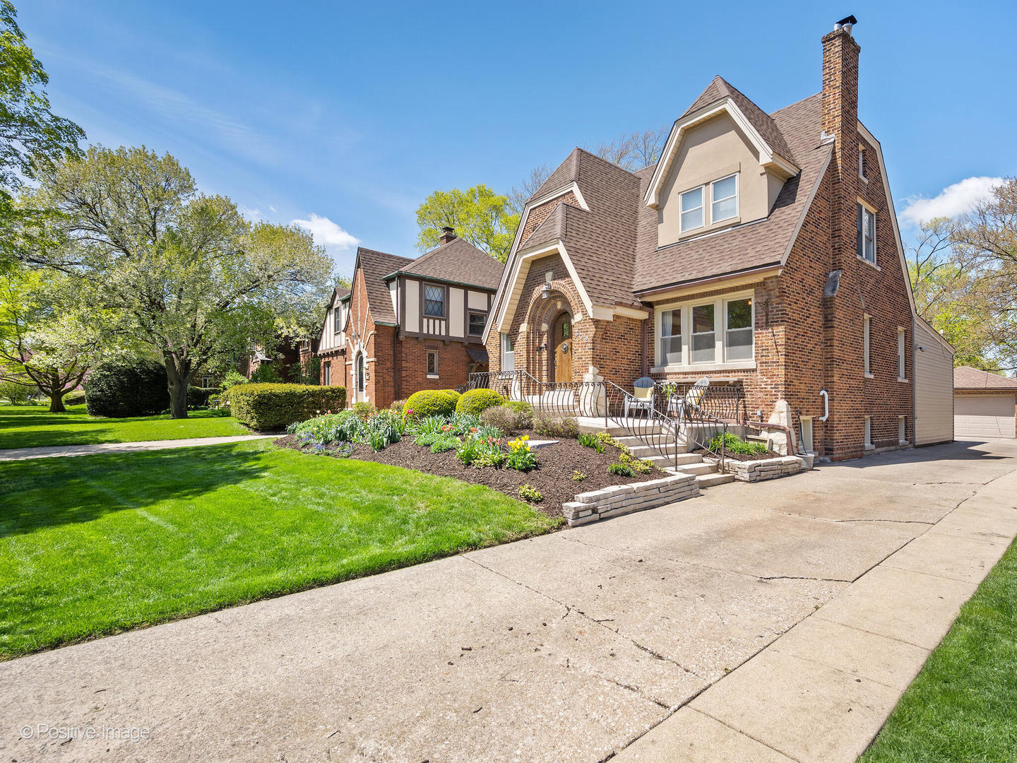 302 Southcote Road Riverside, IL 60546 - Photo 2 of 40 a front view of a house with garden