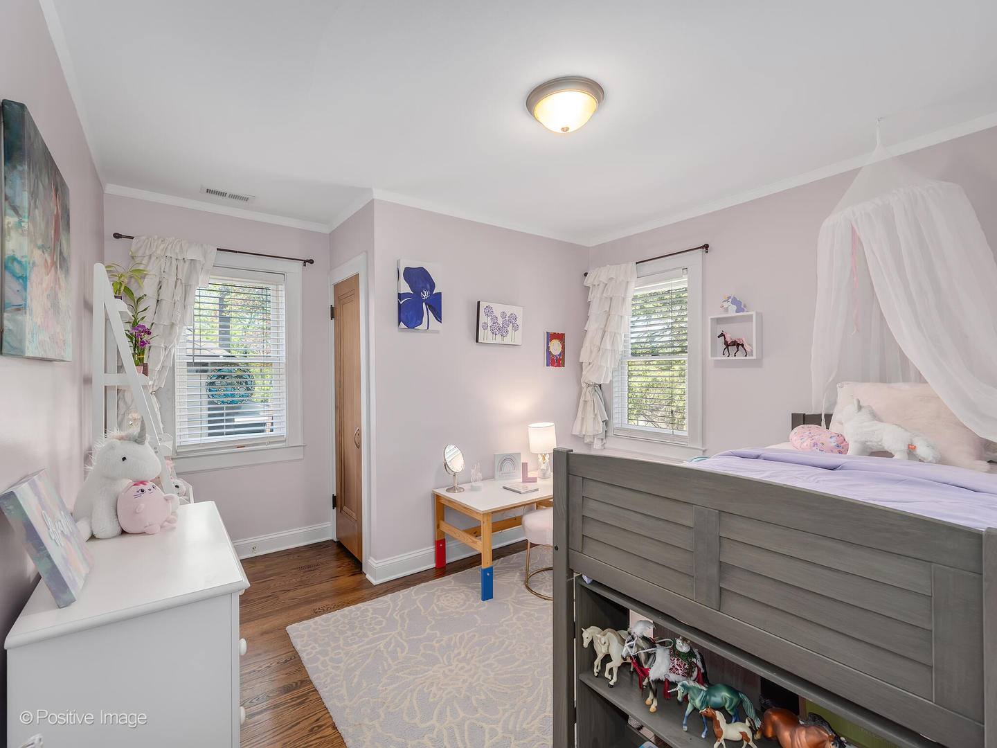 302 Southcote Road Riverside, IL 60546 - Photo 25 of 40 a room with a baby bed a couch and a window