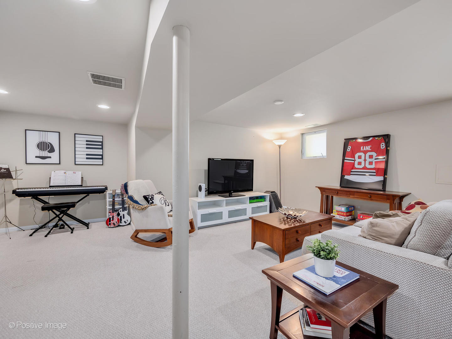 302 Southcote Road Riverside, IL 60546 - Photo 28 of 40 a living room with furniture and a flat screen tv