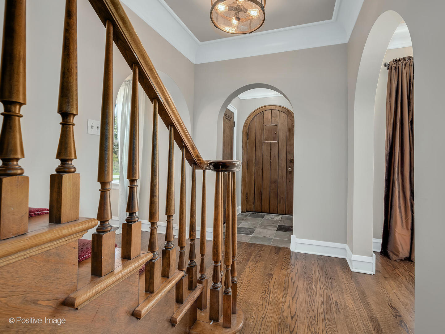 302 Southcote Road Riverside, IL 60546 - Photo 4 of 40 a view of front door with hallway and wooden floor