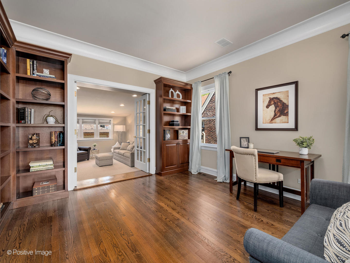 302 Southcote Road Riverside, IL 60546 - Photo 9 of 40 a living room with furniture and a book shelf