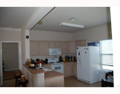 8001 Loomis Drive Corpus Christi, TX 78414 - Photo 4 of 7 a kitchen with refrigerator and window