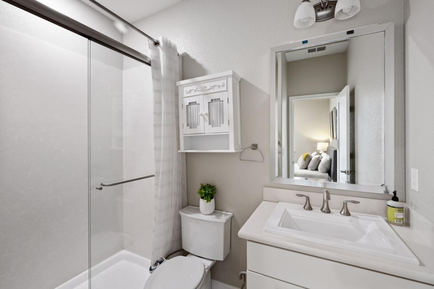 5977 Larkstone Loop San Jose, CA 95123 - Photo 36 of 63 a bathroom with a sink toilet and mirror