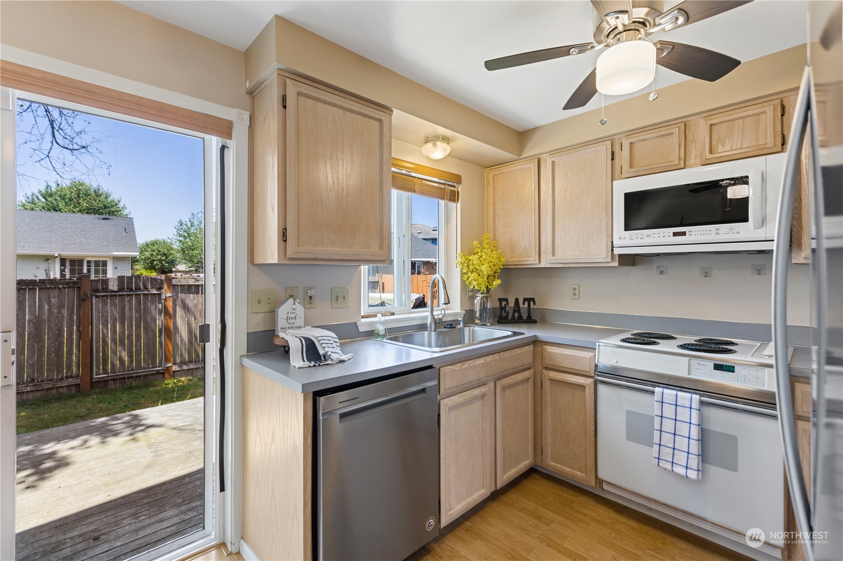 17514 Spring Ln Avenue Marysville, WA 98271 - Photo 4 of 8 a kitchen that has a sink and a stove in it