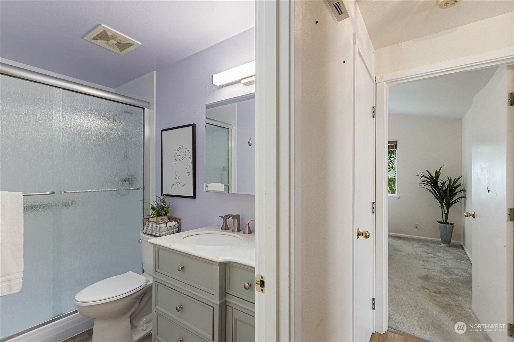 17514 Spring Ln Avenue Marysville, WA 98271 - Photo 7 of 8 a bathroom with a sink a toilet and shower