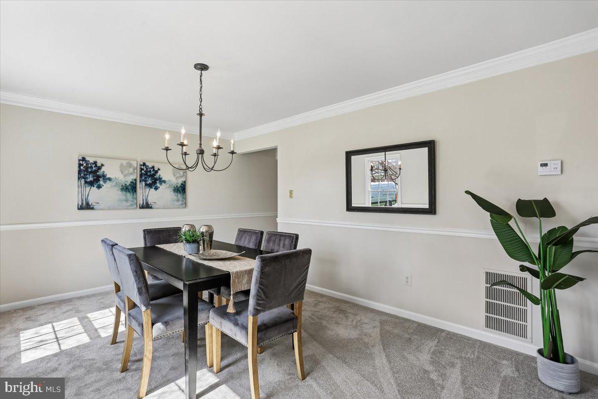 17413 Rio Dulce Court Olney, MD 20832 - Photo 5 of 85 Formal Dining Room with crown molding