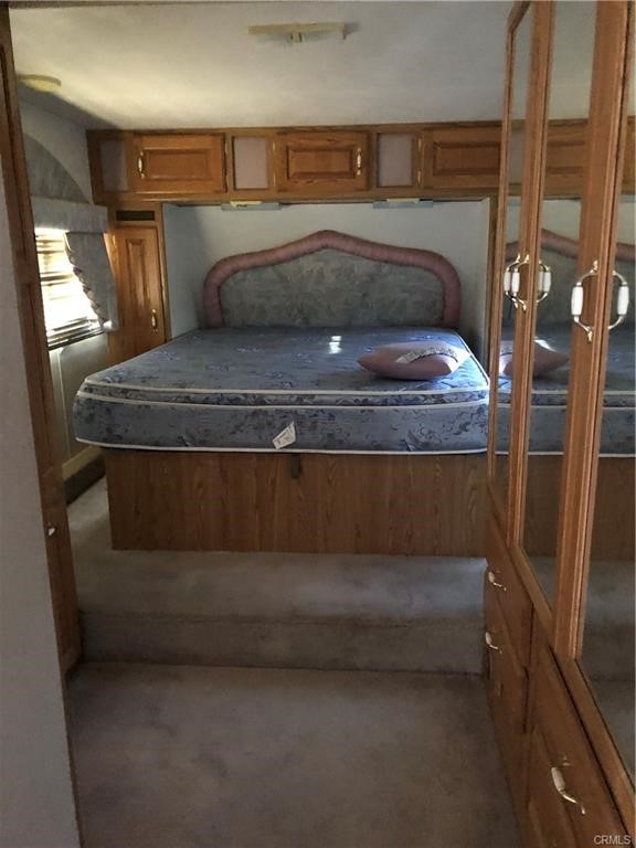 58160 Bliss Road Anza, CA 92539 - Photo 7 of 24 a bedroom with a bed and a mirror