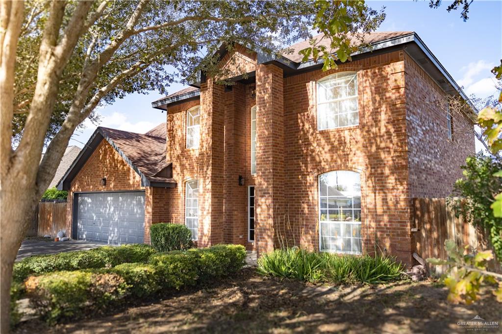 1709 School Lane Mission, TX 78572 - Photo 1 of 1 a front view of a house with a garden