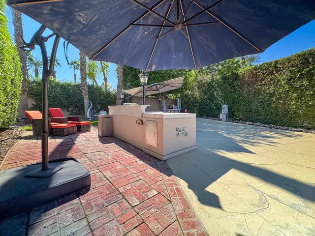 a view of a backyard with sitting area