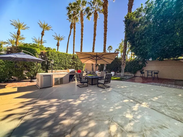 a view of a swimming pool with sitting area