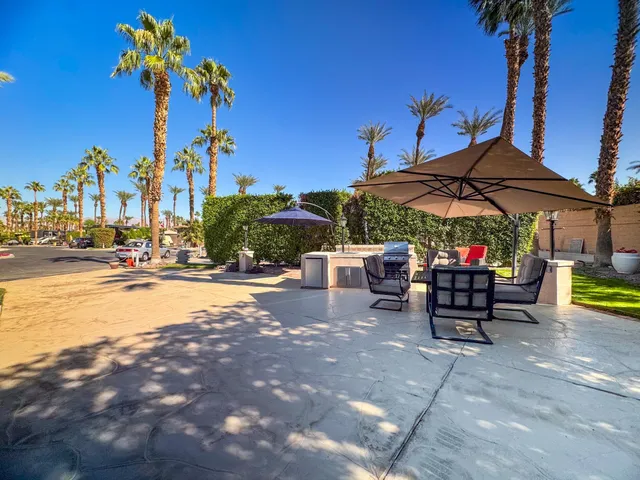 a view of a swimming pool with a lounge chairs