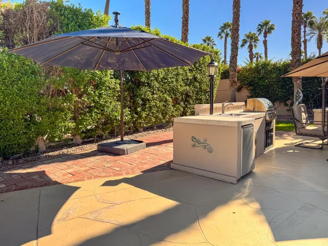 a view of a backyard with sitting area