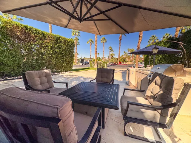 a view of an outdoor sitting area with furniture