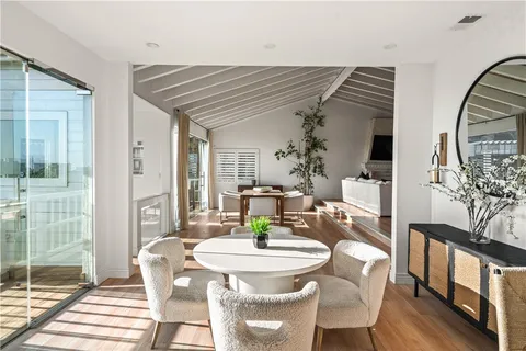 a view of a hallway view of living room and dining room