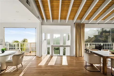 a bedroom with a bed and a potted plant