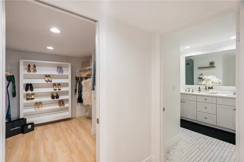 a bathroom with double sink and a mirror