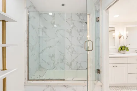 a kitchen with stainless steel appliances granite countertop a table and chairs