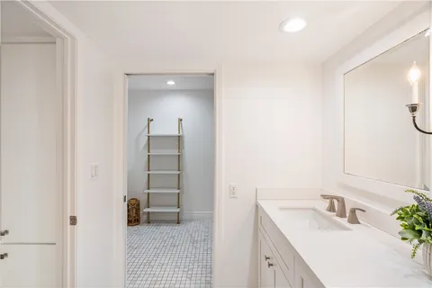 a kitchen with a stove a sink and a refrigerator