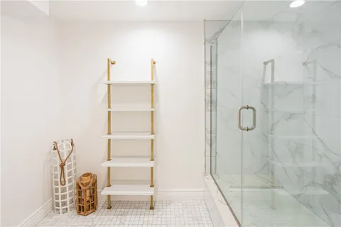 a kitchen with kitchen island a sink and a stove top oven with wooden floor