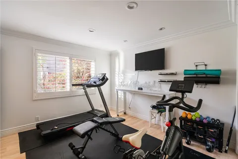 a kitchen with stainless steel appliances kitchen island granite countertop a stove a sink a dining table and chairs