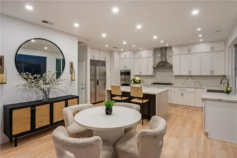 an aerial view of residential house with an outdoor space and seating area