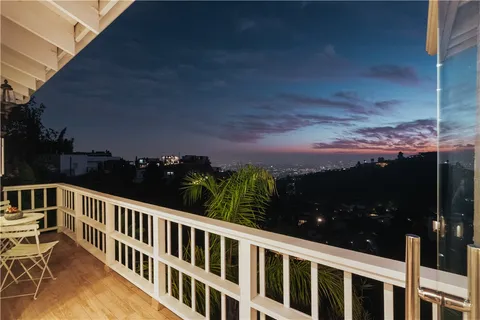 an aerial view of residential building and trees around