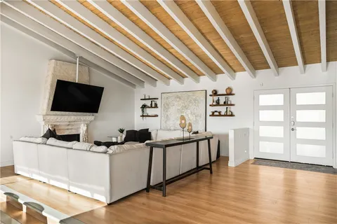 a living room with furniture and flat screen tv