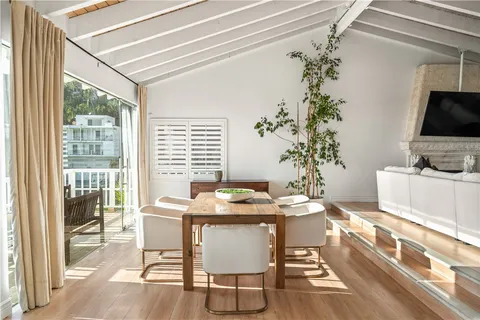a view of a balcony with chairs