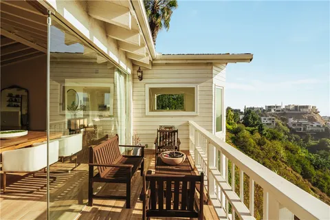 a view of a balcony with chairs