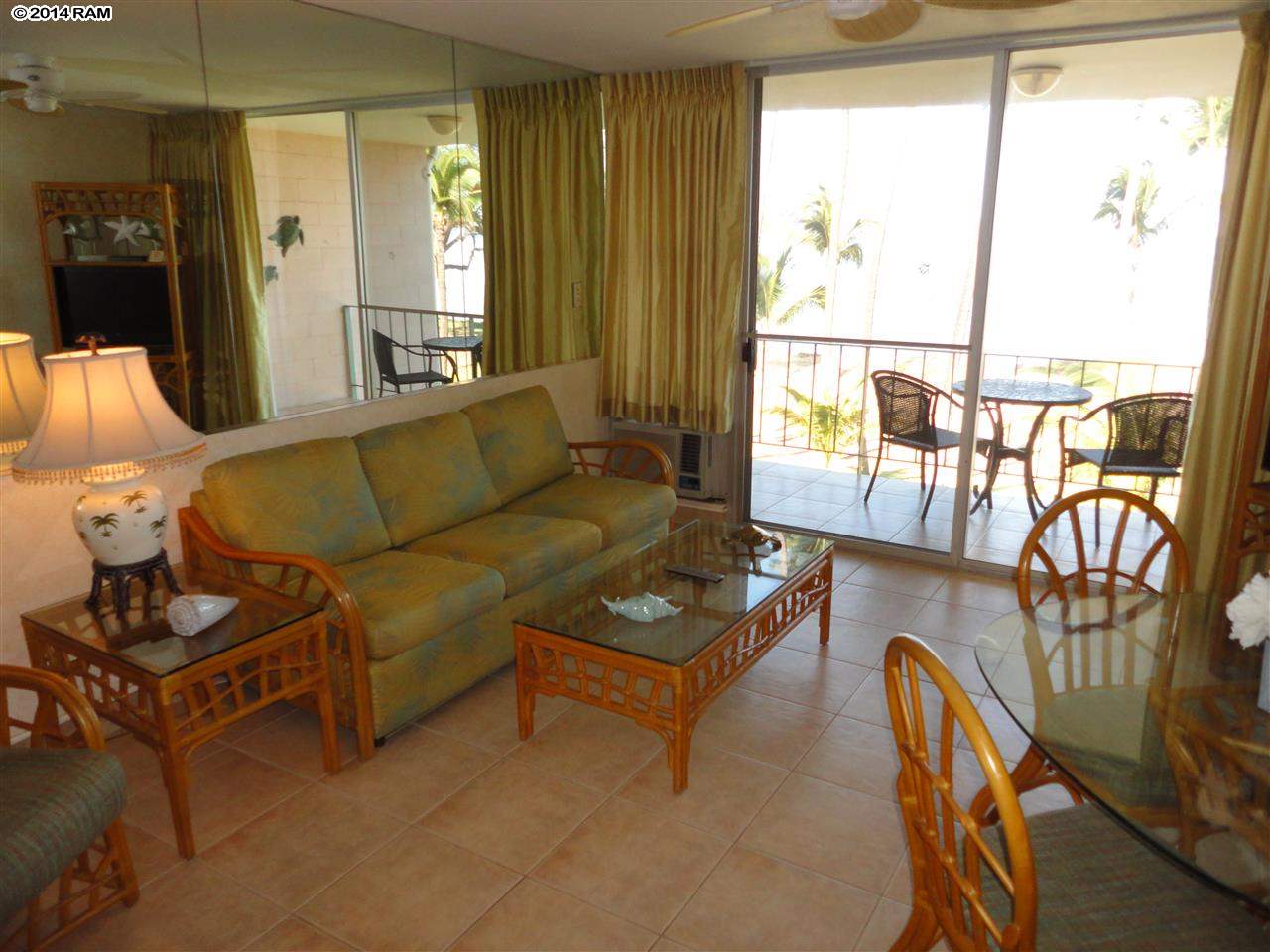 1310 Uluniu Road, Unit 317 Kihei, HI 96753 - Photo 4 of 21 a living room with furniture and a window