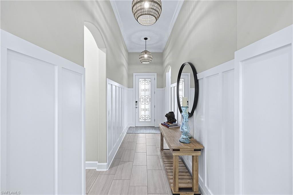 19074 Elston Way Estero, FL 33928 - Photo 18 of 50 a view of a hallway with wooden floor
