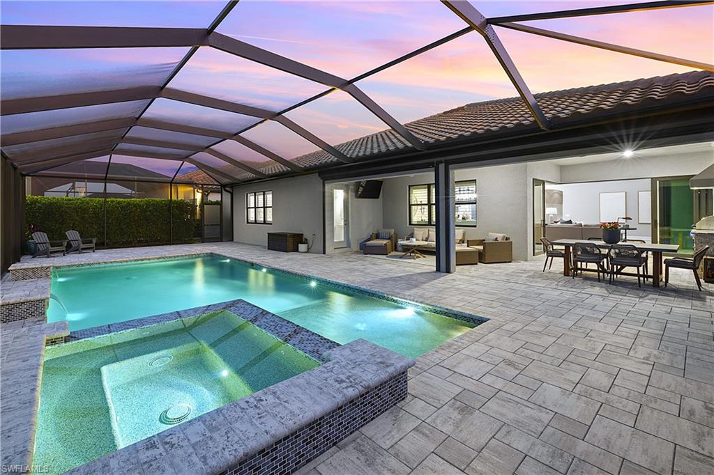 19074 Elston Way Estero, FL 33928 - Photo 2 of 50 a view of a swimming pool with a patio