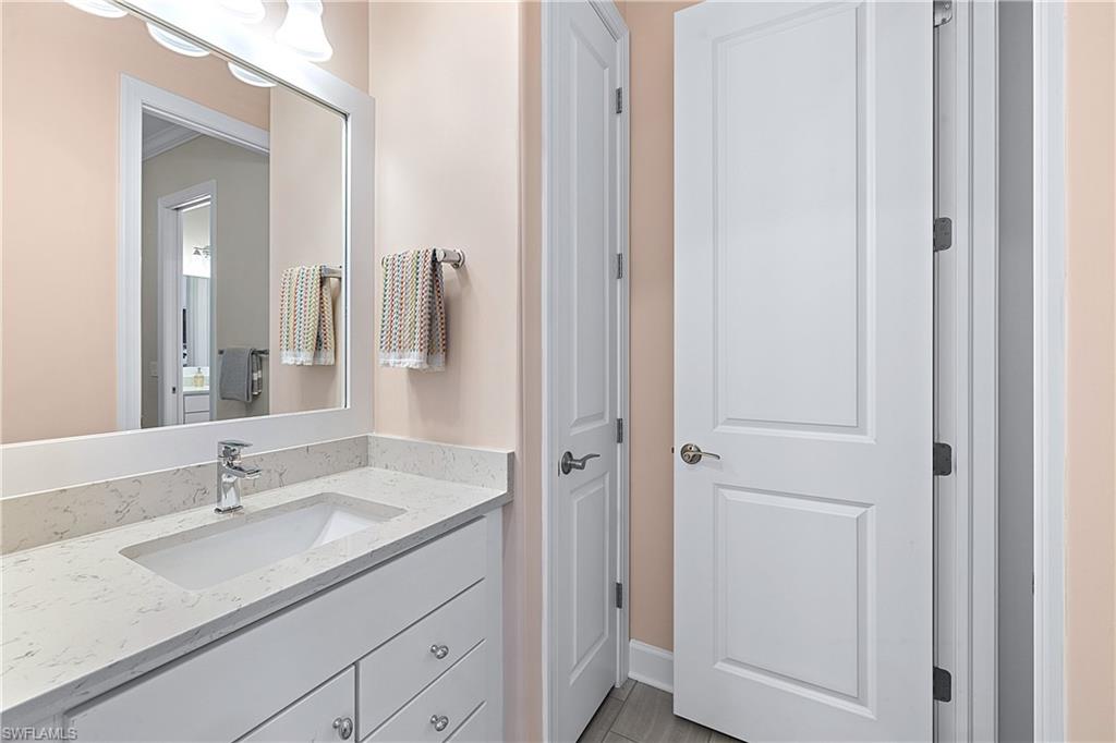 19074 Elston Way Estero, FL 33928 - Photo 22 of 50 a bathroom with a sink and a mirror