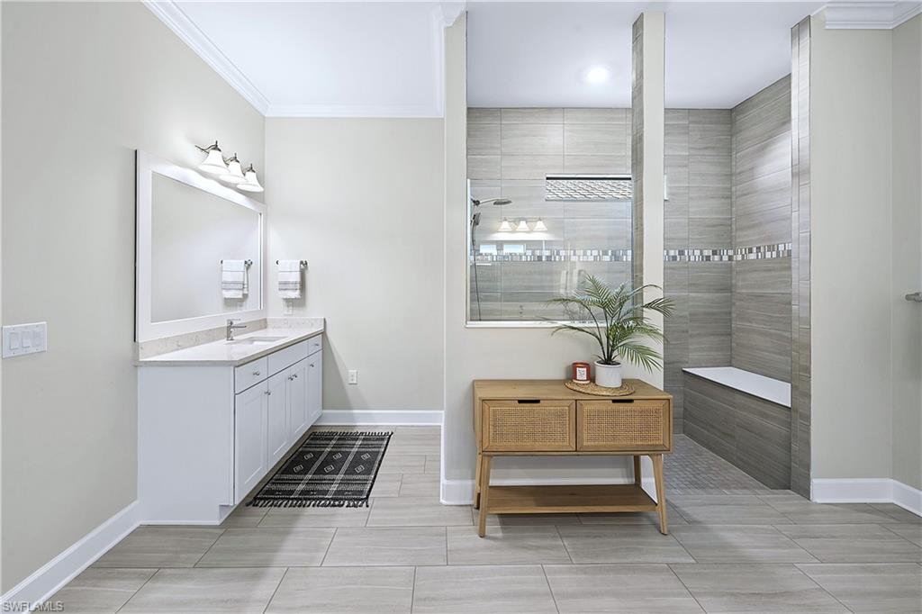 19074 Elston Way Estero, FL 33928 - Photo 29 of 50 a bathroom with a sink a toilet and shower