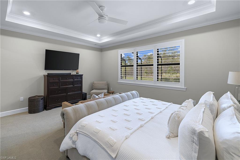 19074 Elston Way Estero, FL 33928 - Photo 31 of 50 a bedroom with two bed and a flat screen tv