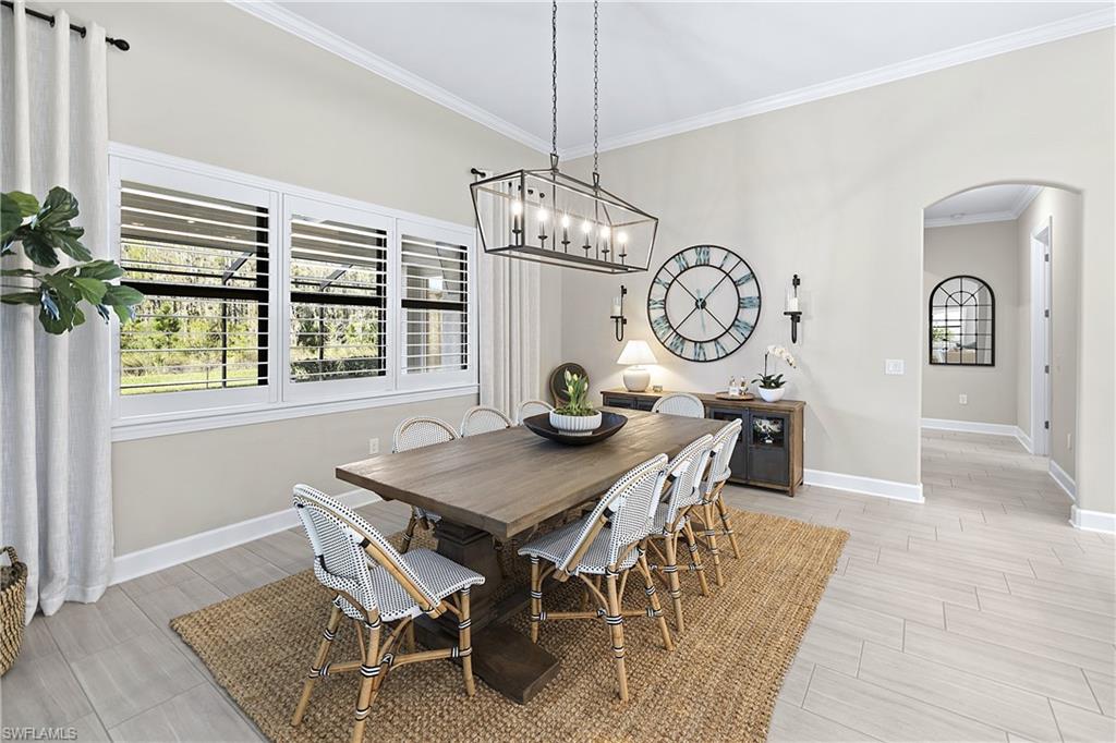 19074 Elston Way Estero, FL 33928 - Photo 35 of 50 a view of a dining room with furniture window and wooden floor