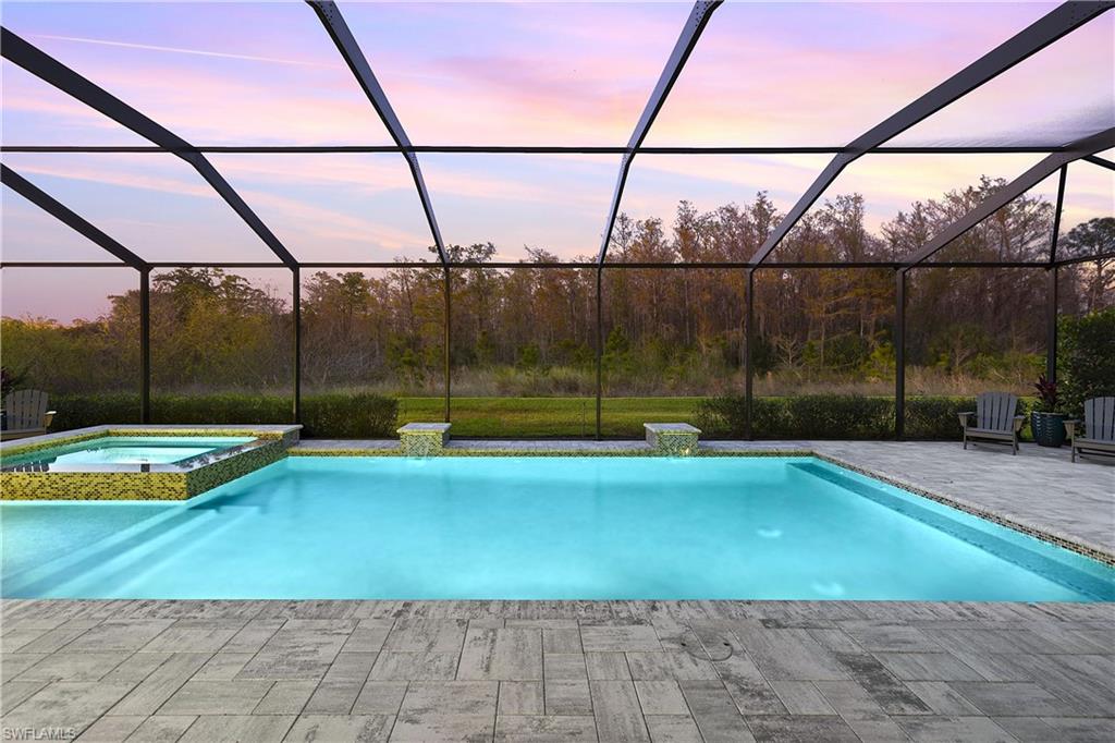 19074 Elston Way Estero, FL 33928 - Photo 4 of 50 a view of a swimming pool with a yard