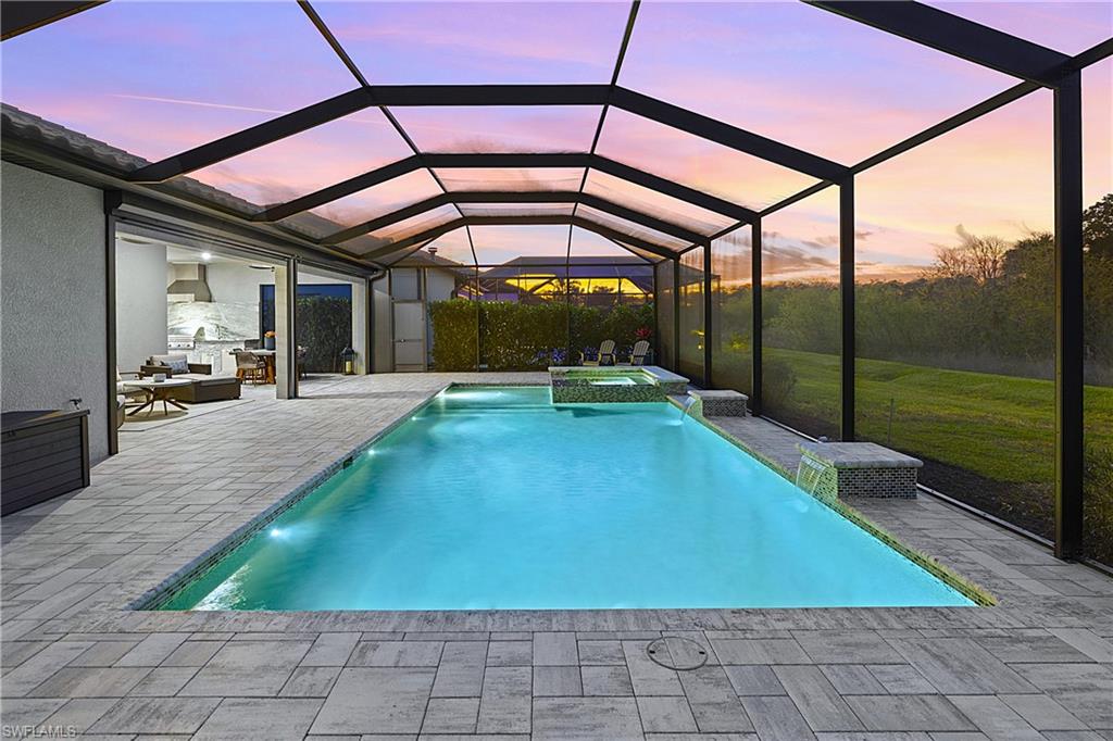 19074 Elston Way Estero, FL 33928 - Photo 6 of 50 a swimming pool with an outdoor seating