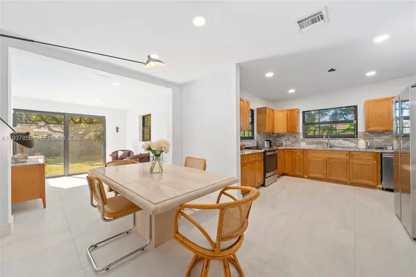 a kitchen with stainless steel appliances granite countertop counter space a sink and cabinets