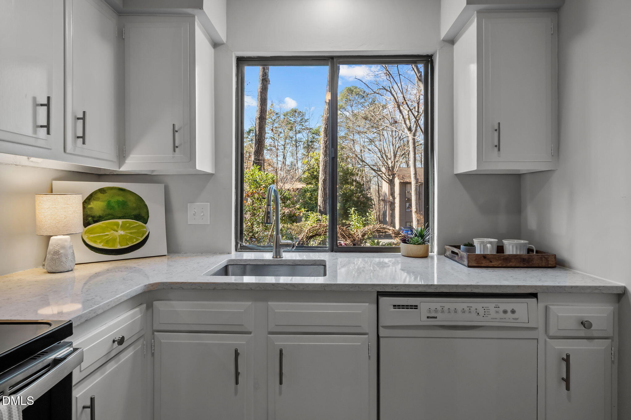 3080 Colony Road, Unit 3080C Durham, NC 27705 - Photo 15 of 57 a kitchen with a sink and cabinets