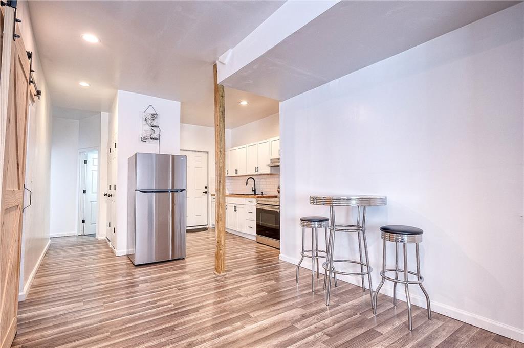 206 North Chestnut Street Derry, PA 15627 - Photo 14 of 33 a kitchen with stainless steel appliances a refrigerator and wooden floor