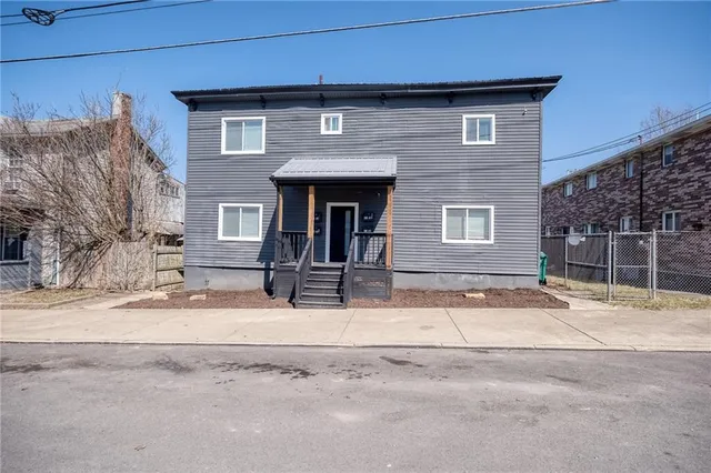 a house with trees in front of it
